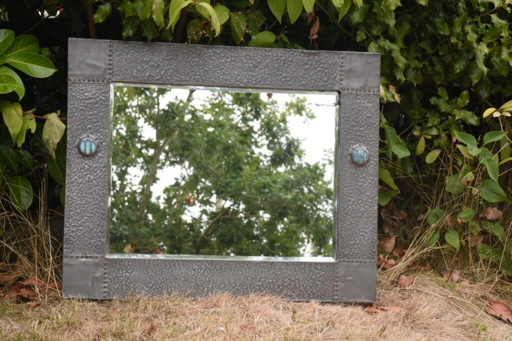 Antique English arts and crafts pewter mirror with ruskin