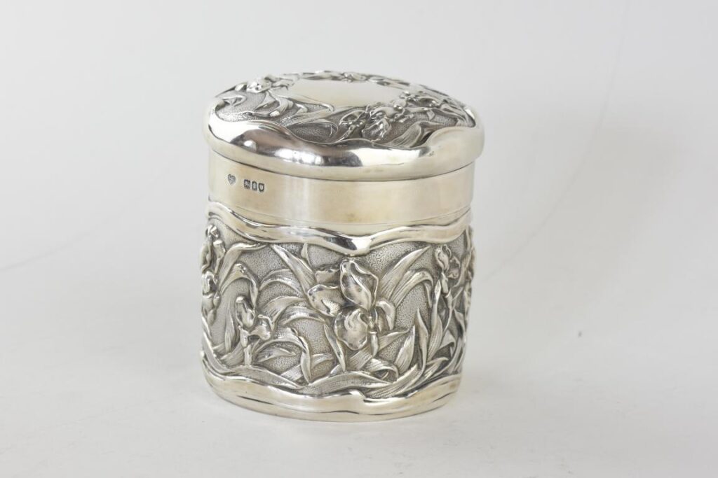 English silver art npuveau caddy decorated with iris flowers